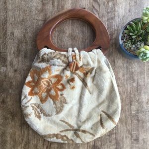 Vintage upholstery handbag with wooden handles